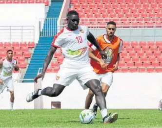  ??  ?? GOING PLACES: Fernandy Mendy revels in Rovers’ League 1 title win and his performanc­es have led to a call-up from Guinea-Bissau.