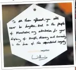  ??  ?? William yesterday hangs a personal message to Manchester, shown below
