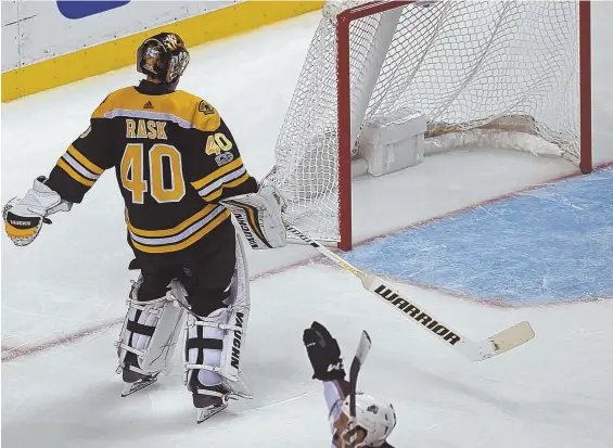  ?? STaff pHoTo by NaNCy LaNE ?? EMPTY FEELING: Tuukka Rask reacts after skating too far away from the net chasing a puck and instead giving up a goal to the Avalanche’s Nail Yakupov (bottom) during the Bruins’ 4-0 loss yesterday at the Garden.