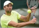  ??  ?? Big hit: Ivo Karlovic in practice at SW19