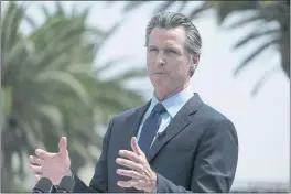  ?? RINGO H.W. CHIU — THE ASSOCIATED PRESS ?? Gov. Gavin Newsom talks during a news conference at Universal Studios in Universal City on Tuesday.