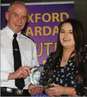  ??  ?? Eden Fitzgibbon, New Ross No Name Club, receives her award from Chief Superinten­dent John Roche.