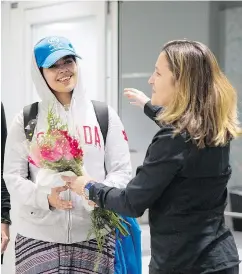  ?? — THE CANADIAN PRESS ?? Refugee Rahaf Mohammed Alqunun is greeted by Canadian Foreign Affairs Minister Chystia Freeland at Toronto’s Pearson airport Saturday.