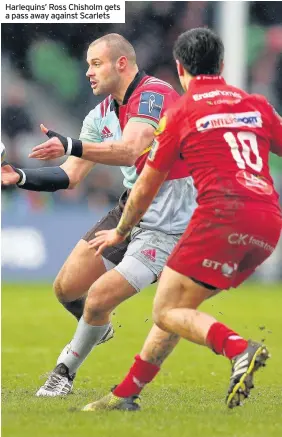  ??  ?? ANGLO WELSH CUP RUGBY Harlequins’ Ross Chisholm gets a pass away against Scarlets