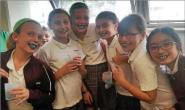  ?? PHOTO COURTESY OF HOLY FAMILY SCHOOL ?? Holy Family students were treated to blue water ice Wednesday afternoon after the school received word it had been named a National Blue Ribbon School.