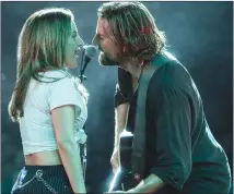  ?? Associated Press photo ?? This image released by Warner Bros. Pictures shows Lady Gaga, left, and Bradley Cooper in a scene from “A Star is Born.”