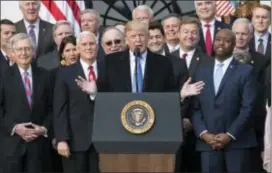  ?? CAROLYN KASTER — THE ASSOCIATED PRESS ?? President Donald Trump joined by Senate Majority Leader Mitch McConnell of Ky., Vice President Mike Pence, Speaker of the House Paul Ryan, R-Wis., Sen. Tim Scott, R-S.C., front right, and other members of congress, speaks during an event on the South...