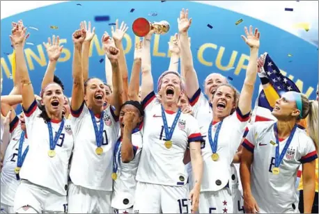  ?? FRANCK FIFE/AFP ?? The USA players celebrate with the trophy after the France 2019 Women’s World Cup final between USA and the Netherland­s on Sunday at the Lyon Stadium in Lyon, central-eastern France.