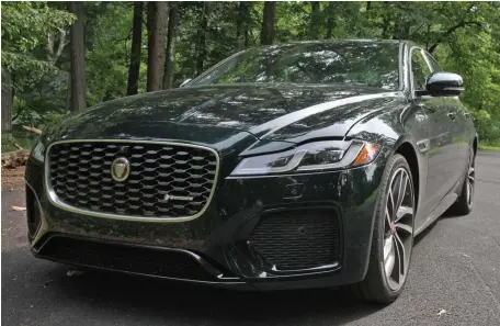  ?? MARC GRASSO PHOTOS / BOSTON HERALD ?? SLEEK AND STYLISH: The Jaguar XF gives you a lot of bang for your buck, getting you into the luxury world without costing you an arm and a leg. The curves, the comfort and the class, it’s all there.
