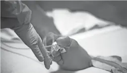  ??  ?? A patient receives treatment in one of Valleywise hospital’s COVID-19 units.