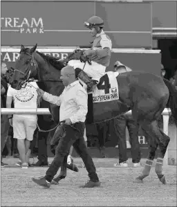  ?? LAUREN KING/COGLIANESE PHOTOS ?? Trainer Alexis Delgado leads Jeltrin, who won at 51-1 odds in the Davona Dale at Gulfstream on Saturday.