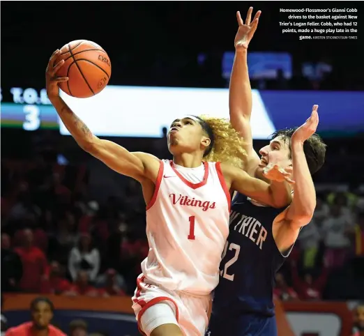  ?? KIRSTEN STICKNEY/SUN-TIMES ?? Homewood-Flossmoor’s Gianni Cobb drives to the basket against New Trier’s Logan Feller. Cobb, who had 12 points, made a huge play late in the game.