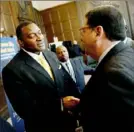  ?? Michael Henninger/Post-Gazette ?? Dr. Anthony Hamlet, left, greets Mayor Bill Peduto after being announced as the new Pittsburgh Public Schools superinten­dent in May 2016.