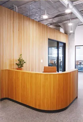  ??  ?? BELOW RIGHT: MSDS Studio created a curved oak tambour wall for the reception area.