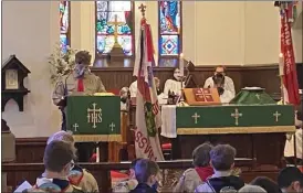  ?? ?? Local Scouts take part in a service Sunday at St. Gabriel’s Episcopal Church, Amity Township, marking the merger of Birdsboro and Douglassvi­lle troops.