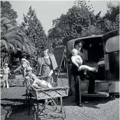  ?? ALEXANDER TURNBULL LIBRARY ?? Patients from the Wilson Home for Crippled Children in Auckland’s Takapuna prepare for a trip to hospital during the polio epidemic.