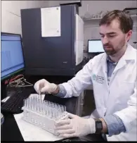  ??  ?? Padraig Brosnan operates a plasma spectromet­er which measure metals.