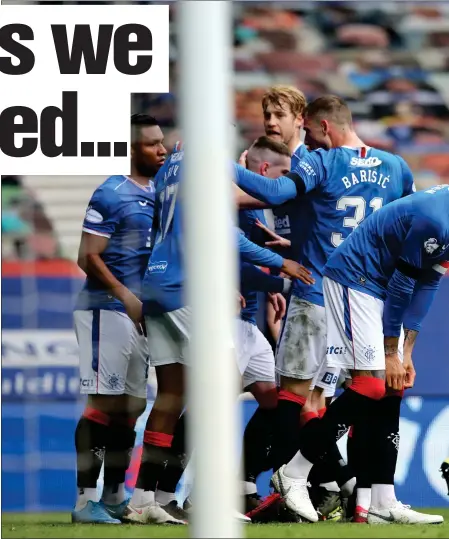  ??  ?? The Rangers players celebrate at Ibrox after Jonjoe Kenny’s own goal put them 2-0 ahead