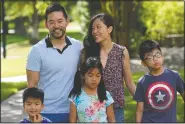  ??  ?? Patrick and Vicky Li Yip pose for a family photograph with their children (from left) Jesse, Kelsey and Toby.