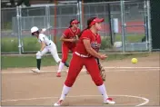  ?? ?? Woodland Christian freshman pitcher Maggie Wurzel delivers a pitch during a 15-5loss at Rio Americano on Wednesday in Sacramento.