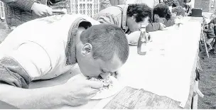  ??  ?? An elver-eating contest at the Bell Inn, Frampton-on-severn