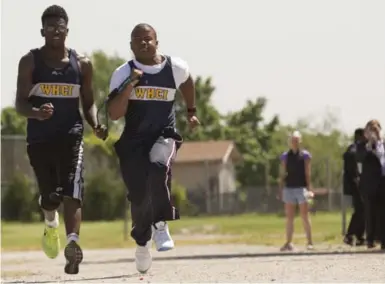  ?? RICK MADONIK/TORONTO STAR ?? Gavin O’Sullivan, right, and Lynden Bennett, his running partner, stretch their legs in a recent competitio­n. They will run in the OFSAA championsh­ips at Varsity Stadium on Friday.