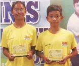 ?? ?? MICA EMANA (left) and Al Licayan hold their trophies after sharing the spotlight in the Olivarez Cup national juniors tournament.