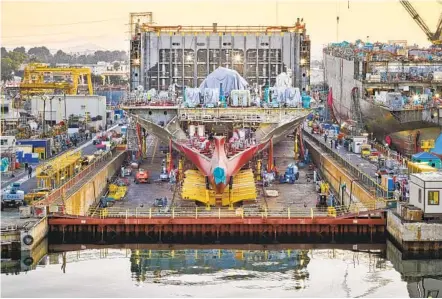  ?? CHRISTOPHE­R PAYNE THE NEW YORK TIMES ?? The container ship Matsonia is under constructi­on at General Dynamics NASSCO’S shipyard in San Diego.