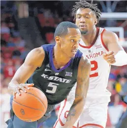  ?? SUE OGROCKI/ASSOCIATED PRESS ?? Kansas State’s Barry Brown, who had 25 points, drives past Oklahoma’s Aaron Calixte during the first half of the Wildcats’ victory over the host Sooners.