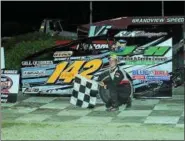  ?? RICK KEPNER - FOR DIGITAL FIRST MEDIA ?? Ryan Lilick poses in victory lane after winning the sportsman feature at Grandview Speedway on May 20.