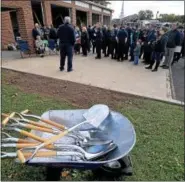  ??  ?? Firefighte­rs, friends and family members mingle before the ground breaking Saturday for the newLimeric­k Fire Company headquarte­rs.