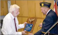  ?? PHOTO COURTESY AMERICAN LEGION ?? Ed Flory receives an award from Commander Duyson a few years ago for his years of service to the American Legion and Rockford Elementary where he attended school. More veterans are now eligible to join the American Legion as the result of legislatio­n signed by President Trump.