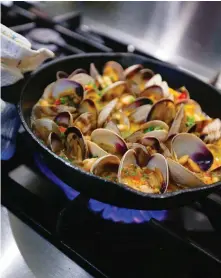  ??  ?? Serve this hearty dish of clams, beans and chorizo with crusty bread for soaking up the sauce.