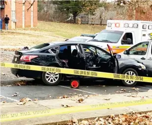  ??  ?? The victim's car was behind crime scene tape at Brookville Garden apartments on Tuesday afternoon. (Photo by Ryan Phillips, SDN)
