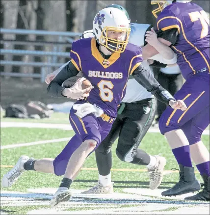  ?? JOHN LOVE / SENTINEL & ENTERPRISE ?? Monty Tech’s T.J. Farr tries to find some running room against Burncoat on Saturday at Oakmont Regional High School.