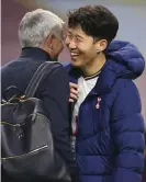  ??  ?? Tottenham’s Son Heung-min (right) jokes with José Mourinho following the final whistle in Burnley. Photograph: Michael Regan/ AP