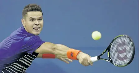  ?? JULIO CORTEZ/AP ?? Milos Raonic returns a shot to Dustin Brown during his first round win at the U.S. Open on Monday. Raonic will play Ryan Harrison on Wednesday in the second round.