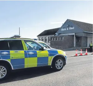  ?? Picture: George Mcluskie. ?? Police vehicles outside the Buck and Hind pub in Buckhaven on Tuesday.