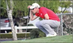  ?? MIKE BUSH/NEWS-SENTINEL ?? Lodi golfer Justin Gums measures up a shot on the ninth hole in Thursday's TCAL match against Lincoln at Woodbridge Golf and Country Club.