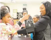  ?? David Hopper ?? Saviannah Edmond attaches the blood pressure cuff to Principal Tracey Walker at Spring ISD’s Roberson Middle School, 1500 Southridge.