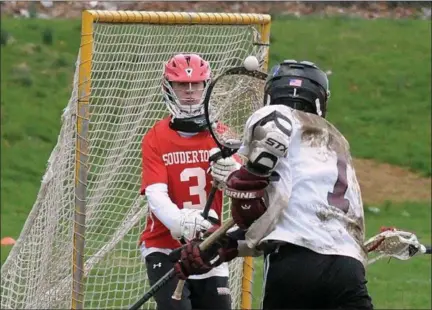  ?? GENE WALSH — MEDIANEWS GROUP ?? Abington’s Shawn McConnell takes a shot on goal as Souderton’s goalie Axell Beskar defends on Friday.