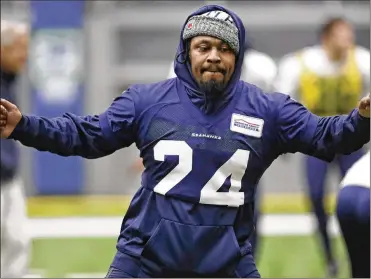  ?? ELAINE THOMPSON / AP ?? Seattle Seahawks running back Marshawn Lynch warms up at the team’s practice facility Tuesday in Renton, Wash. Lynch played his last game for the Seahawks in January 2016. Lynch averaged 4.2 yards per carry last season with Oakland before suffering a season-ending core muscle injury.