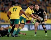  ?? GETTY IMAGES ?? Jermaine Ainsley gets a pass away, during his debut for Australia against New Zealand on Saturday.