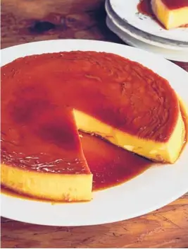  ?? JOE LINGEMAN/THE KITCHN.COM ?? Flan is a custard-based dessert topped with caramel sauce.