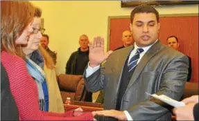  ?? BARRY TAGLIEBER — FOR DIGITAL FIRST MEDIA ?? Patrolman Paul Ansaldo is sworn in at Wednesday night’s Phoenixvil­le Borough Council meeting.