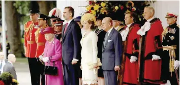  ?? — Reuters ?? Queen Elizabeth and Prince Philip stand with Spain’s King Felipe and Queen Letizia during a ceremonial welcome on Horse Guards Parade, in central London, on Wednesday.