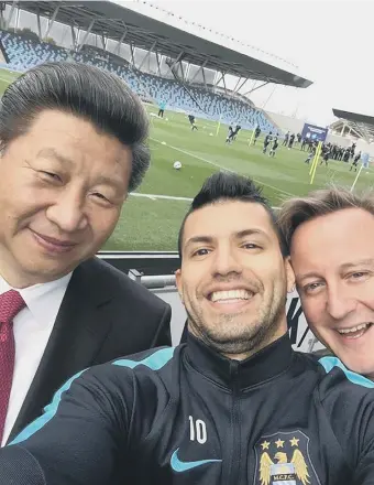  ??  ?? Chinese president Xi Jinping and David Cameron take a selfie with Manchester City striker Segio Aguero