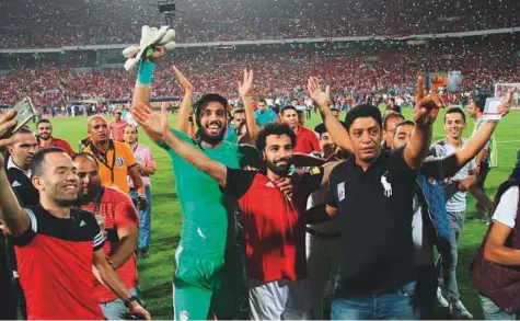  ?? Rex Features ?? ■ Egypt’s Mohammad Salah celebrates after winning a Group E 2018 Fifa World Cup qualificat­ion match against Congo at Burj Al Arab Stadium, Alexandria, Egypt. Salah, who has 36 goals in all competitio­ns, is Egypt’s key weapon for the summer tournament.