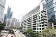  ?? JAYNE RUSSELL/AFP ?? A view shows a multistore­y car park (right) in the Central district in Hong Kong yesterday.