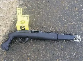  ??  ?? Two sawed-off long-barrelled firearms were recovered at the site of a shooting involving RCMP and two suspects in Grand Prairie on Tuesday.